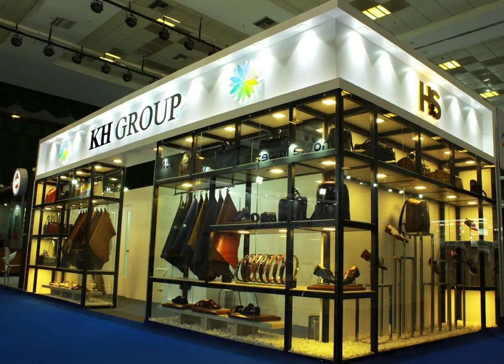 KH Group pavilion with glazed walls and a lit overhead sign