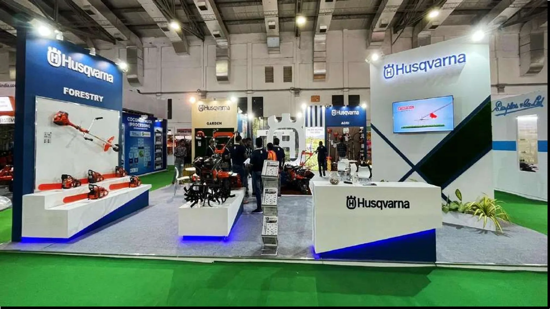 Husqvarna display with product plinths and green flooring