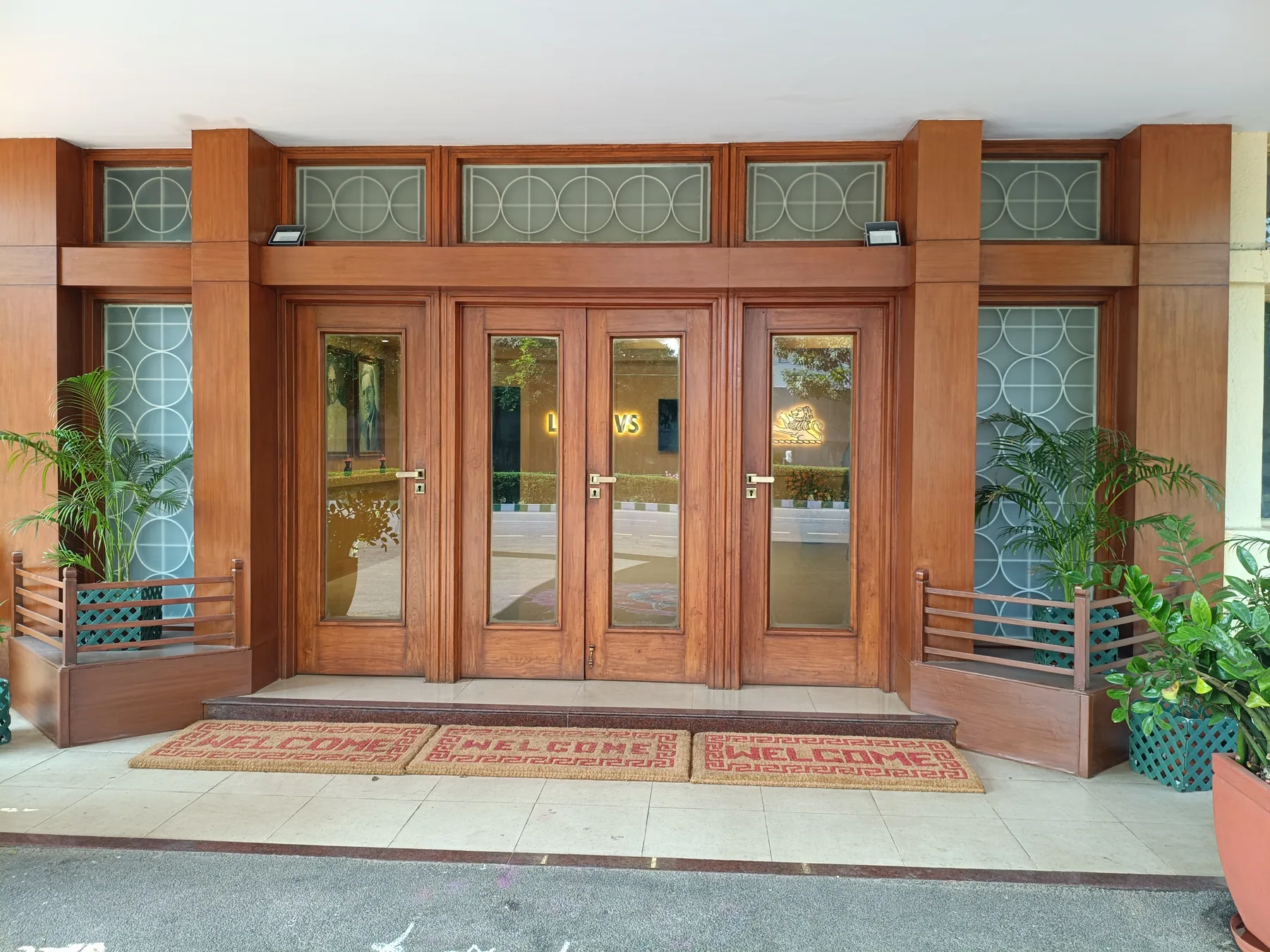 Timber-framed entrance doors with decorative glazing