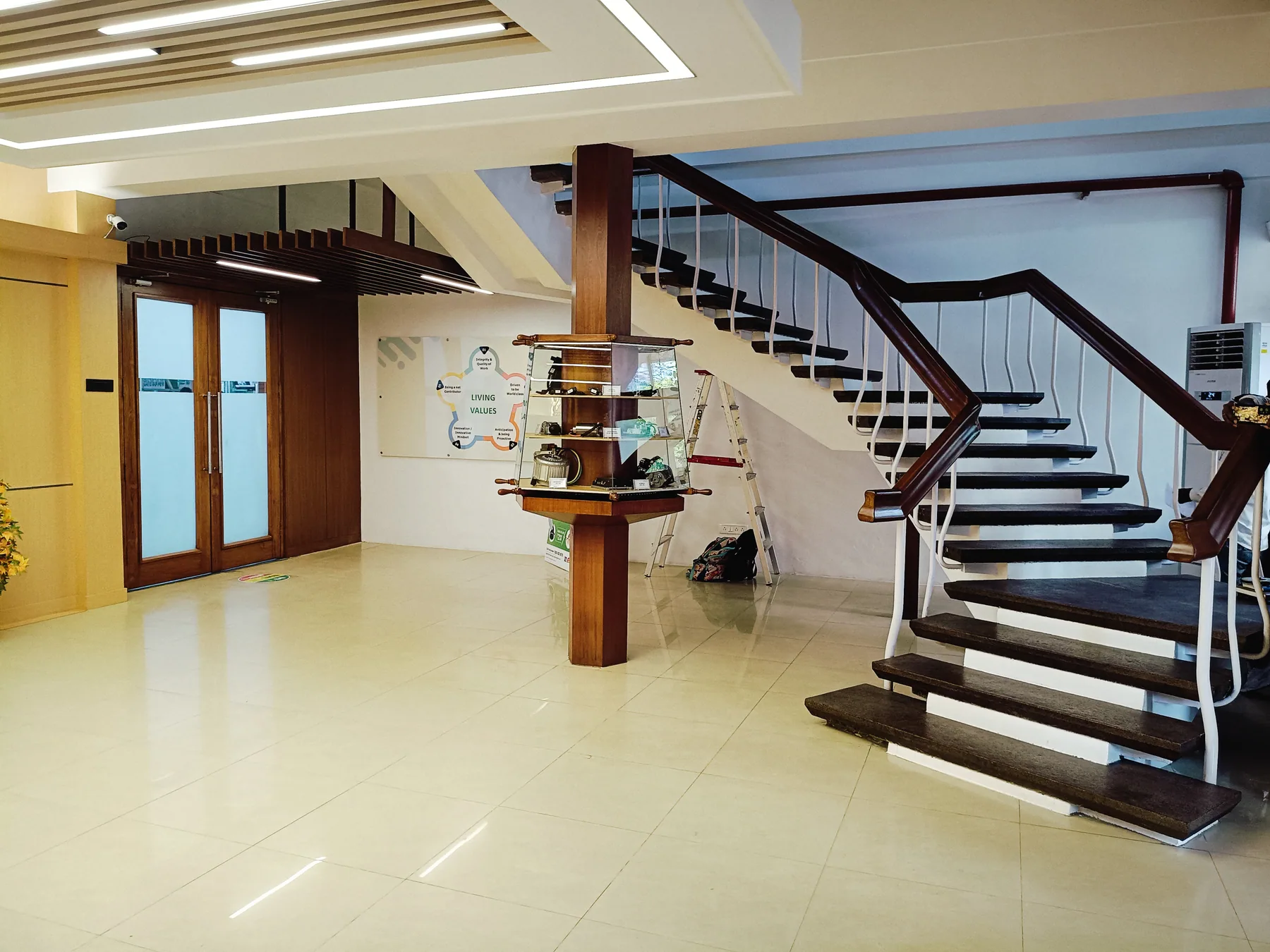 Staircase beside the lobby display cabinet