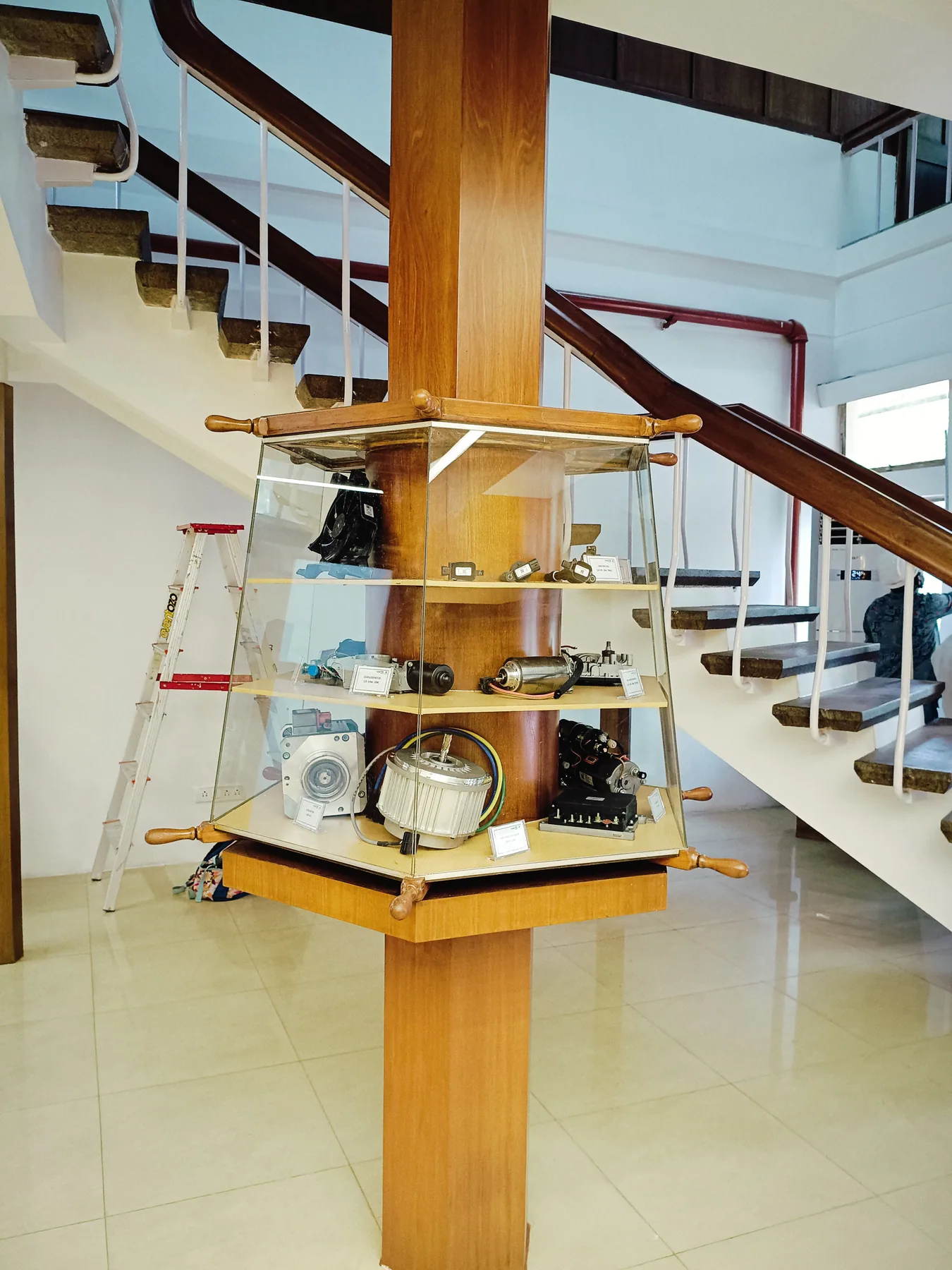 Glass display cabinet beneath the staircase