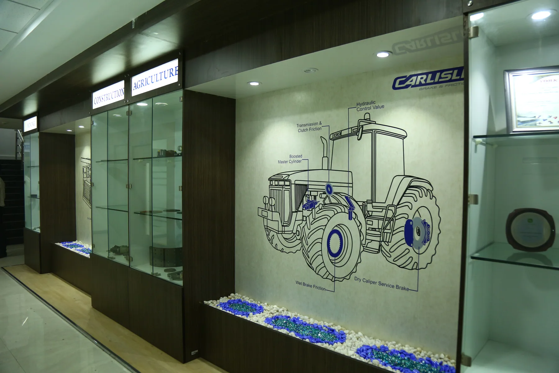 Glazed product displays beside a timber-clad office corridor